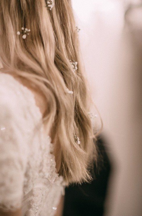wedding hairstyle with tiny flowers